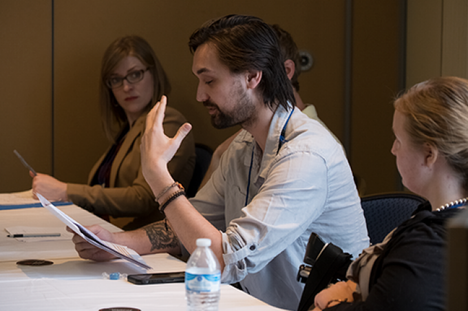 A presenter delivers a paper at a session held at NeMLA's annual convention. 